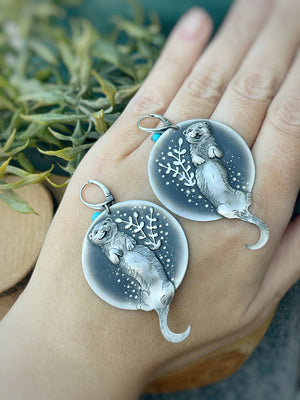 The Otter Floating in The Water Earrings